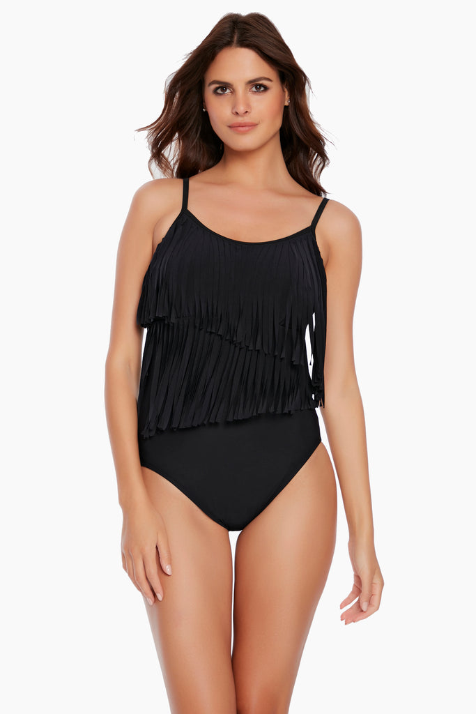 Woman wearing a magic suit one piece swim dress.