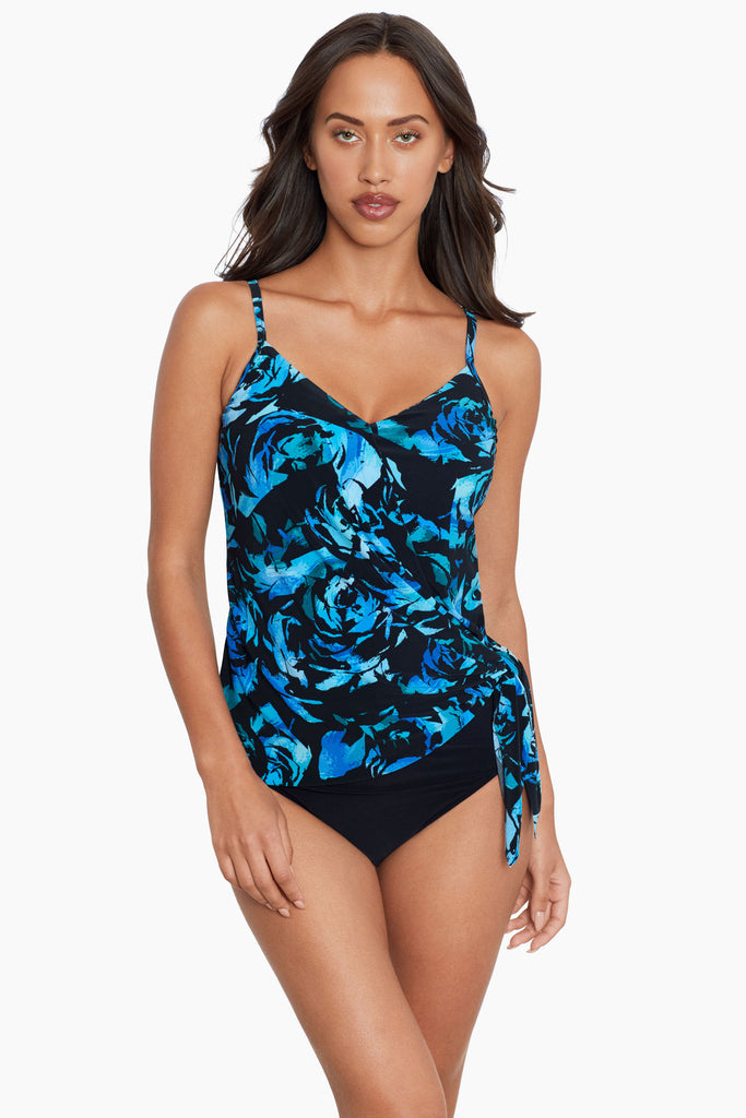 A slim girl wearing a tankini top.