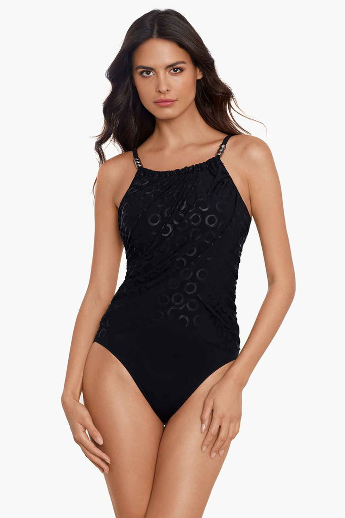 Woman in a magic suit one piece swim suit.