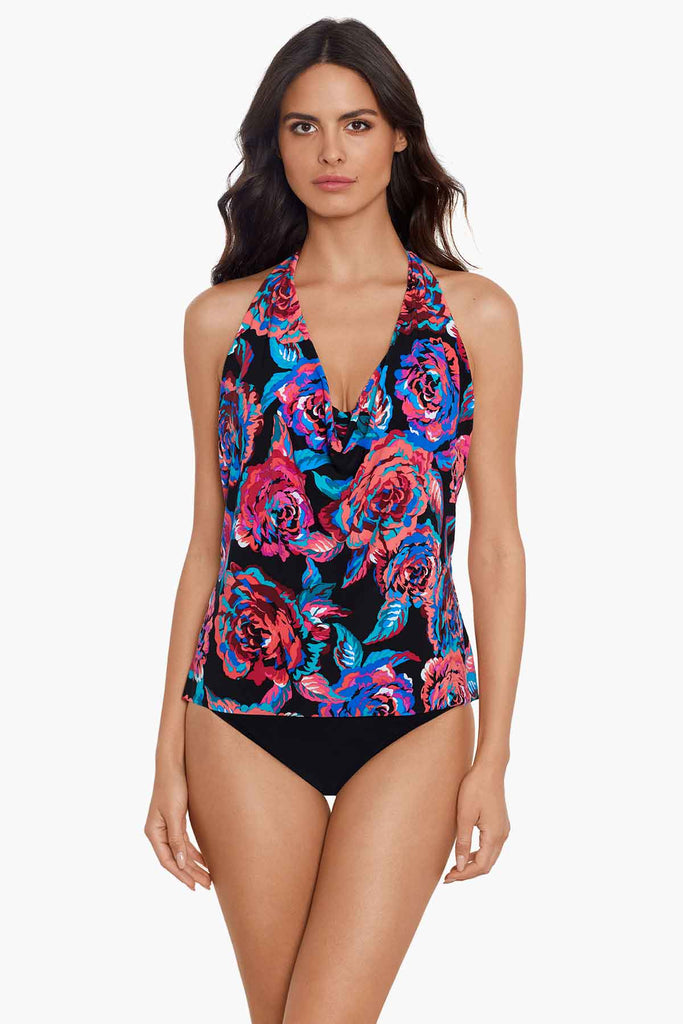 Woman wearing printed tankini top.