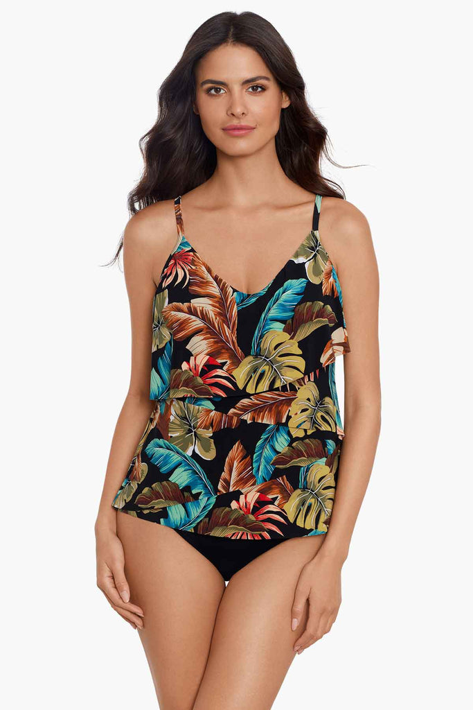 Slim woman wearing a printed tankini top.