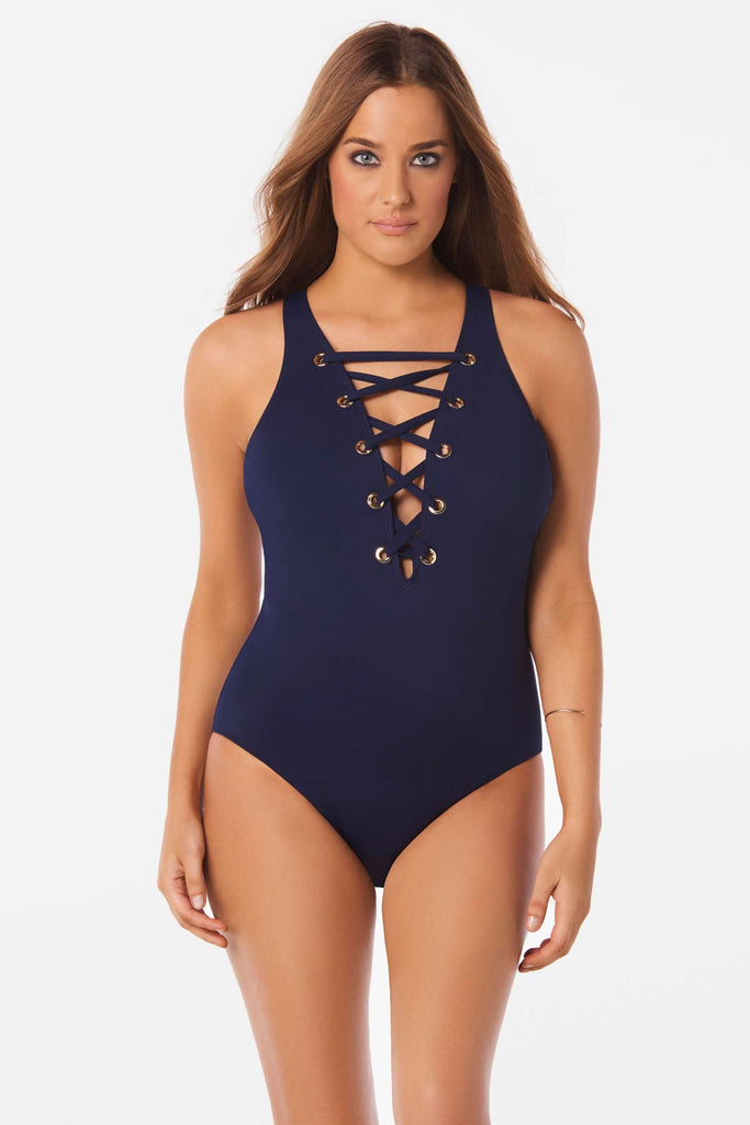 Woman in a stylish one piece swim suit.