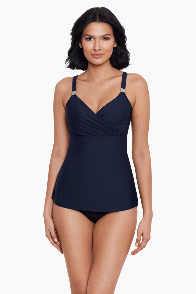 A slim woman wearing a slimming tankini top.