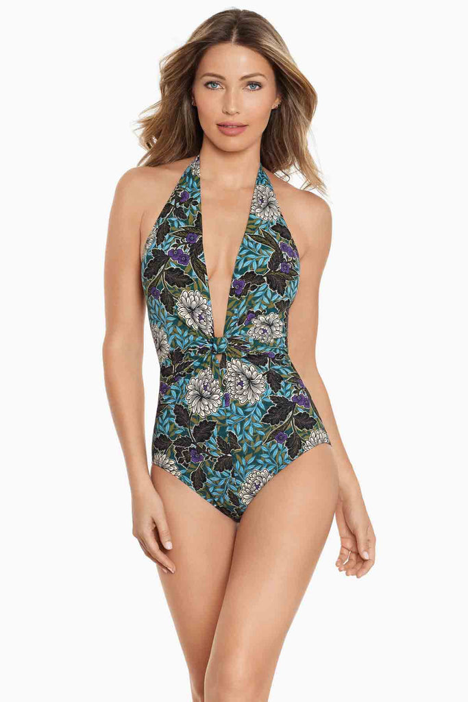 Woman wearing Amoressa swimwear in blue 