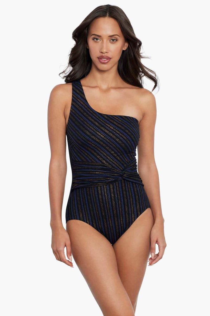 Woman wearing a one piece swim dress.