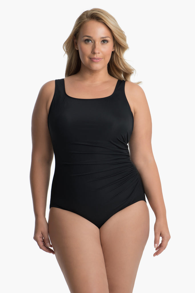 Woman in a one piece swim suit.